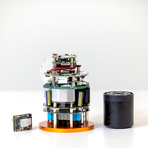 Disassembled Subnero M25M Series Silver Edition modem showing its internal electronics stack, processing board, and transducer housing components